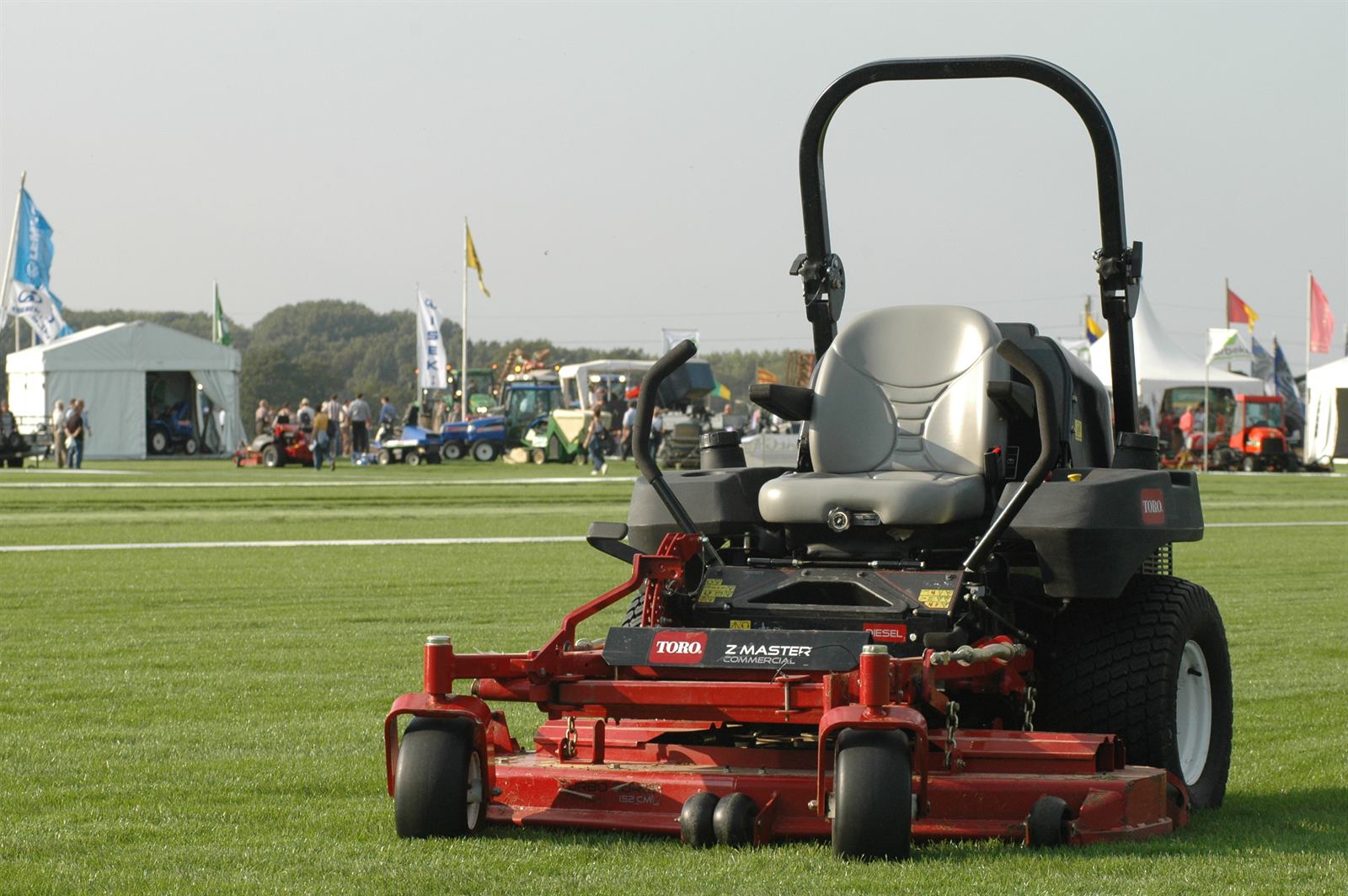Commercial zero-turn mower on a green lawn